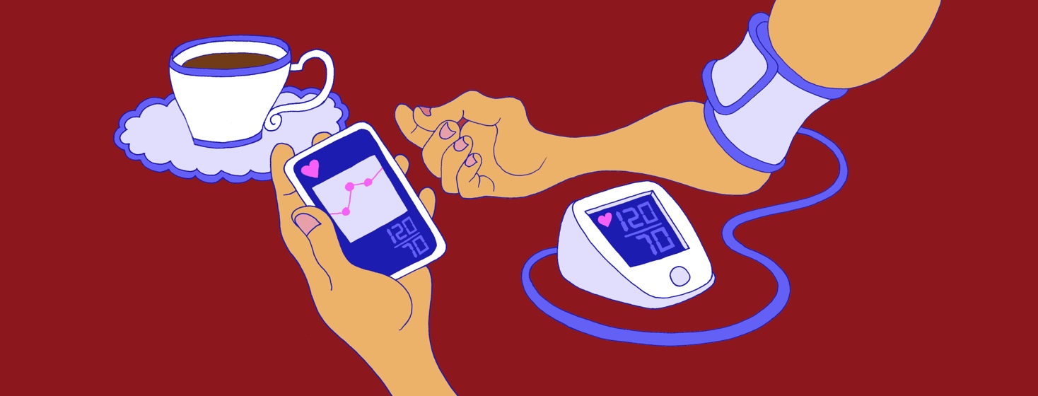 A person uses an at home blood pressure monitor.